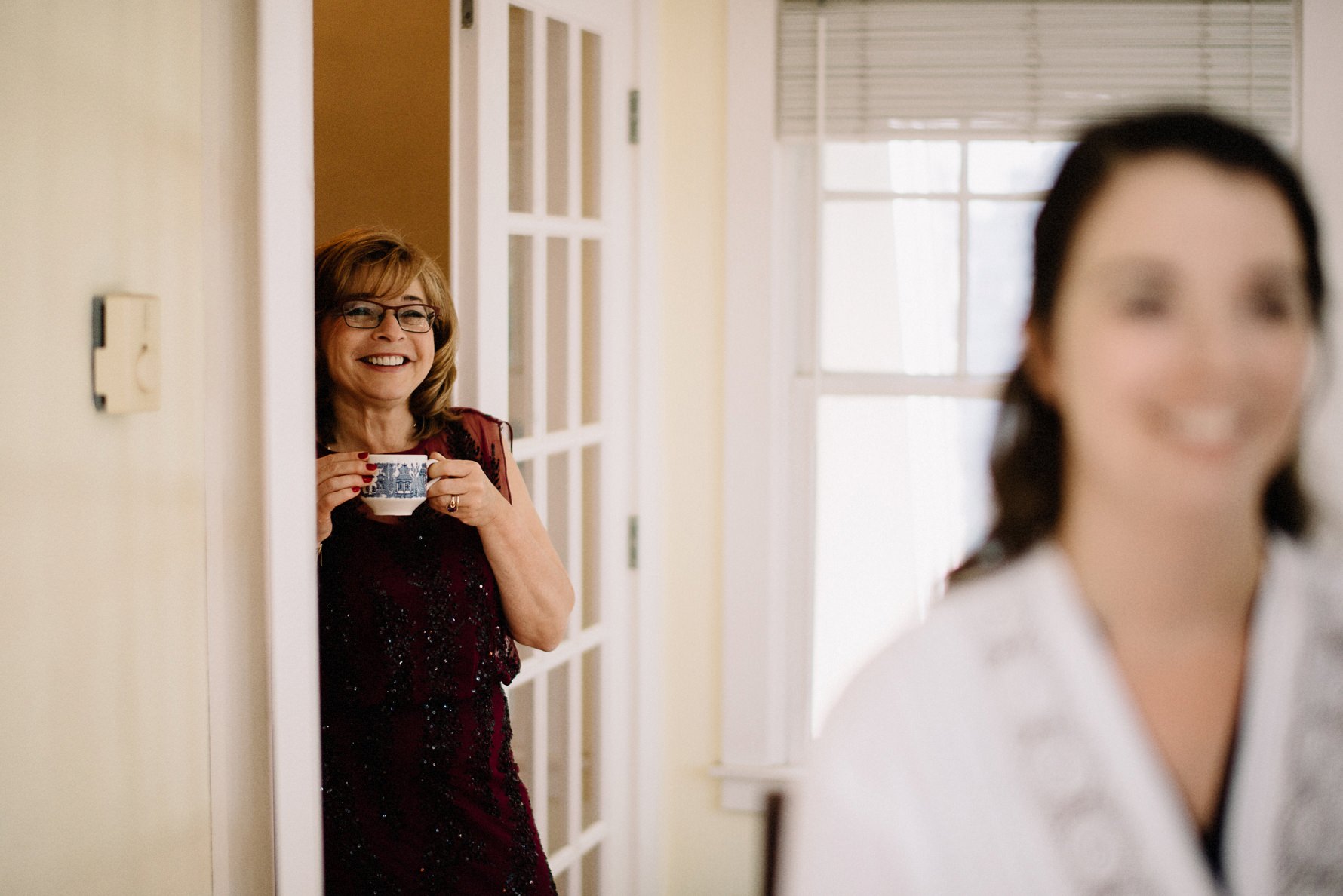 mom looking at bride,