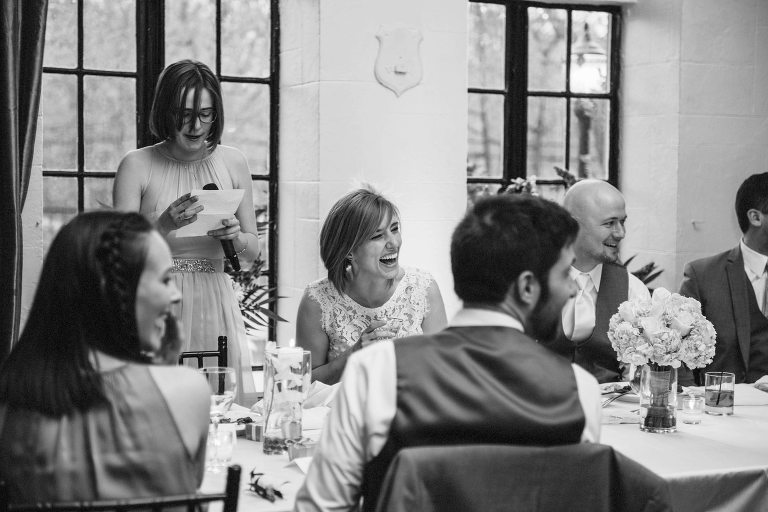 bride laughing during toasts,