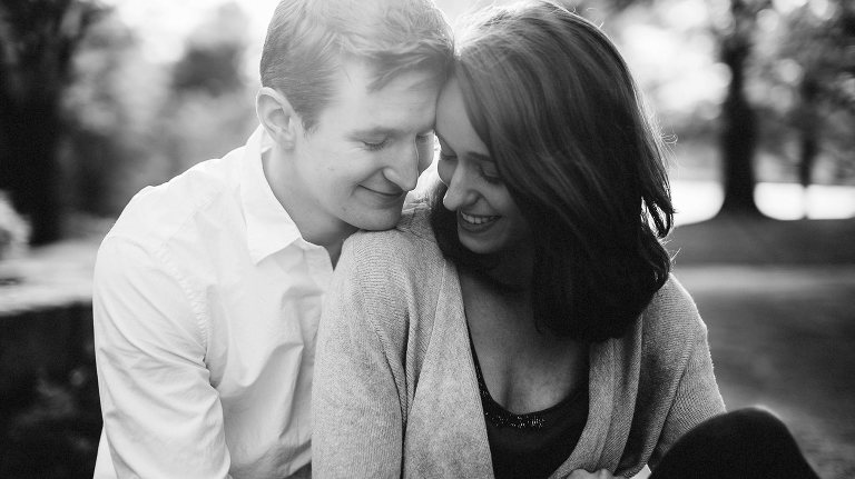 couple smiling in the sun at maudslay state park,